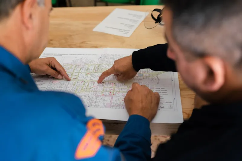 Two contractors reviewing project plans together